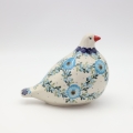 Each dove is carefully shaped from natural clay and hand-painted by skilled Bolesławiec artisans, making every piece truly one-of-a-kind.