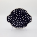 Hand decorated round baking dish with handles made from authentic Boleslawiec pottery.