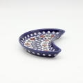 Unique Bolesławiec tray in crescent shape, perfect for serving snacks.