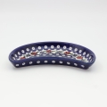 Unique Bolesławiec tray in crescent shape, perfect for serving snacks.