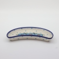 Unique Bolesławiec tray in crescent shape, perfect for serving snacks.