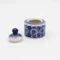 Detail of hand-painted decoration on Boleslawiec sugar bowl with lid.
