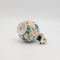 Hand-painted round decanter made from traditional Bolesławiec pottery. Unique ceramic bottle perfect for serving liqueurs, water, or as a table decoration.