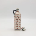 Hand-painted striped teapot made from traditional Bolesławiec pottery. A stylish and functional piece perfect for serving tea and decorating the kitchen.