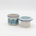 Hand-painted water butter dish made from traditional Bolesławiec pottery. A practical kitchen accessory designed to keep butter fresh and spreadable longer.