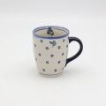 Hand-painted BEL mug made from traditional Bolesławiec pottery. A stylish mug perfect for coffee, tea, and everyday use.