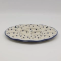 Hand-painted ANDY egg plate made from traditional Bolesławiec pottery. A functional serving dish perfect for presenting eggs for breakfast or festive occasions.
