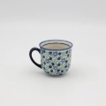 Hand-painted cup made from traditional Bolesławiec pottery. Elegant and functional, perfect for serving coffee and tea for everyday use or special occasions.