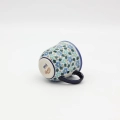Hand-painted cup made from traditional Bolesławiec pottery. Elegant and functional, perfect for serving coffee and tea for everyday use or special occasions.