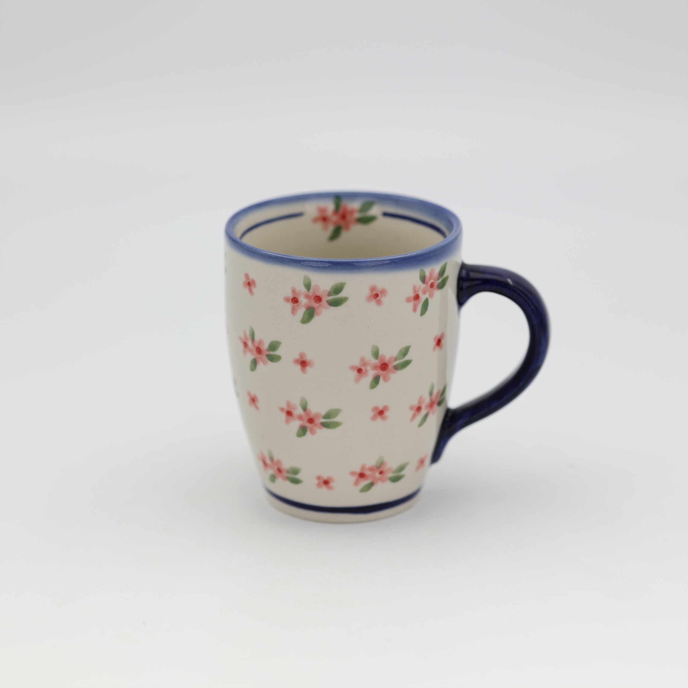 Mug BEL A38 D141 – hand-painted Bolesławiec pottery in a traditional pattern, practical and decorative for everyday use.