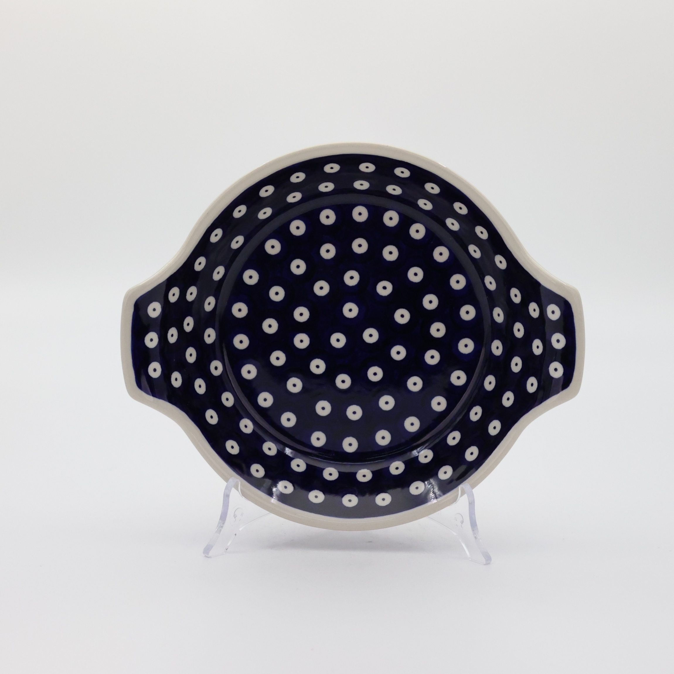 Hand decorated round baking dish with handles made from authentic Boleslawiec pottery.