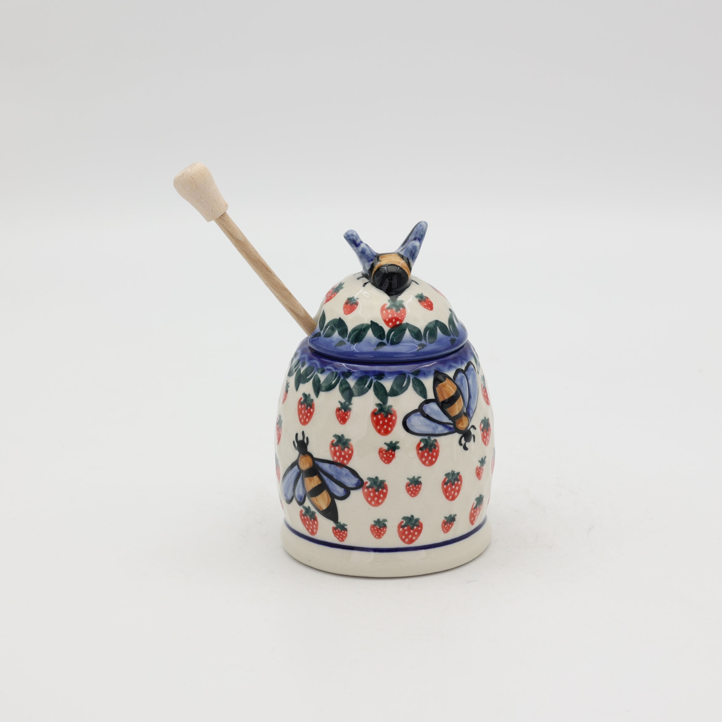 Hand-painted honey pot made from traditional Bolesławiec pottery. A stylish and practical container perfect for storing and serving honey.