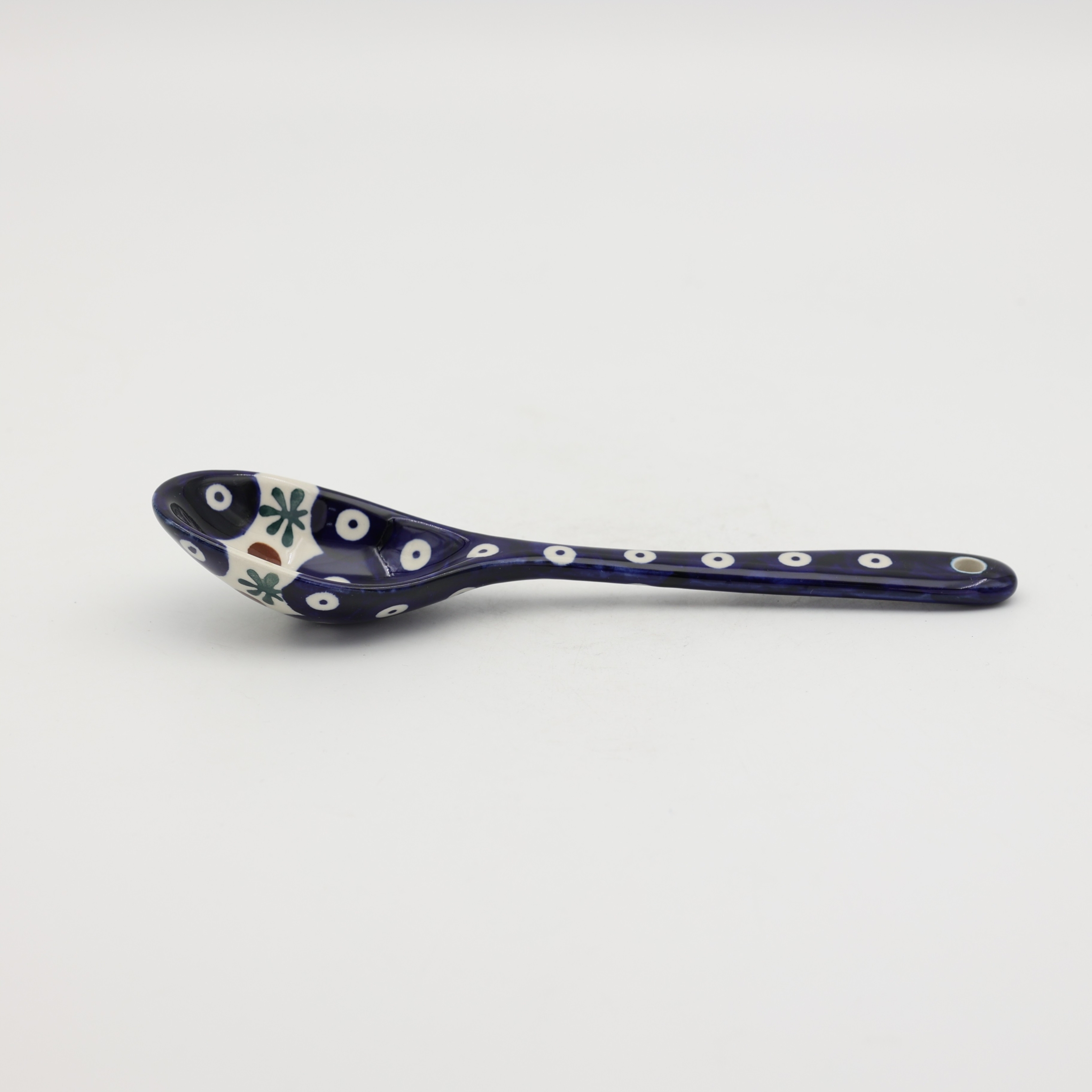 This large ceramic spoon is perfect for serving dishes, stirring meals, or adding a unique touch to your kitchen décor.